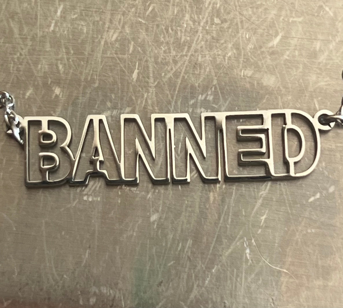 BANNED 1.5” Silver Logo & Chain